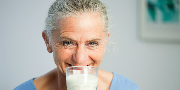 Mature woman drinking milk